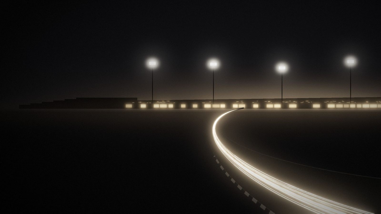 Long-exposure light trails sweeping through a corner at a floodlit circuit at night.